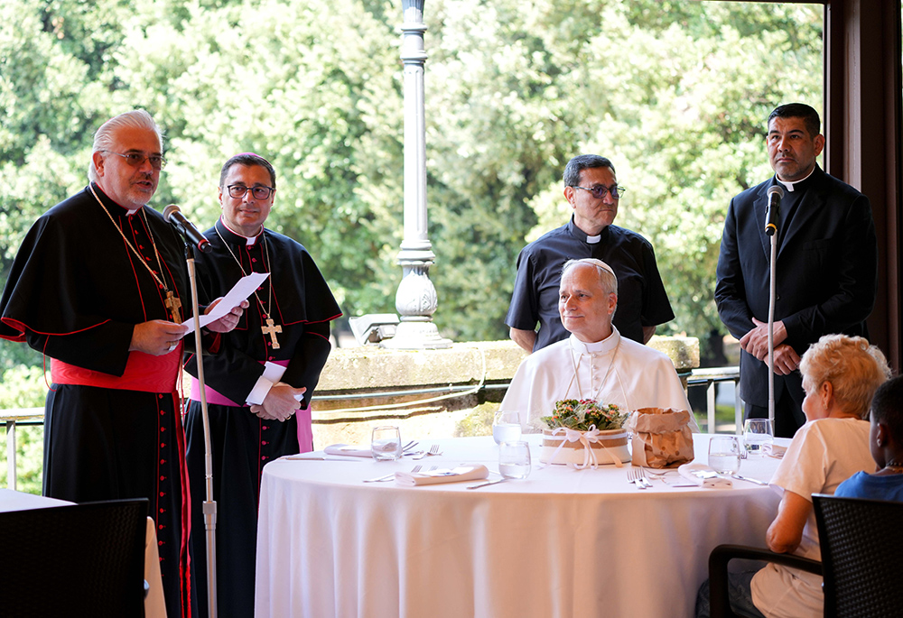 Cardinal Fabio Baggio, undersecretary of the Dicastery for Promoting Integral Human Development, speaks during a lunch with Pope Leo XIV and guests assisted by the Albano diocesan Caritas agency in Borgo Laudato Si' at the papal villa of Castel Gandolfo, Italy, Aug. 17, 2025. (CNS/Lola Gomez)