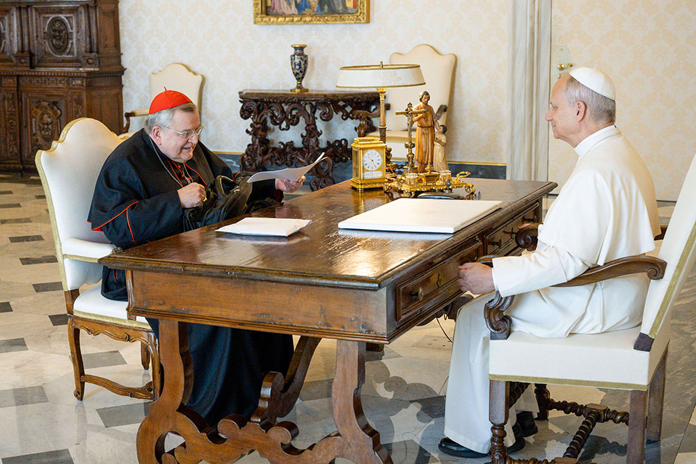 Cardinal Raymond Burke and Pope Leo XIV meet in the library of the Apostolic Palace at the Vatican Aug. 22, 2025. (CNS/Vatican Media)