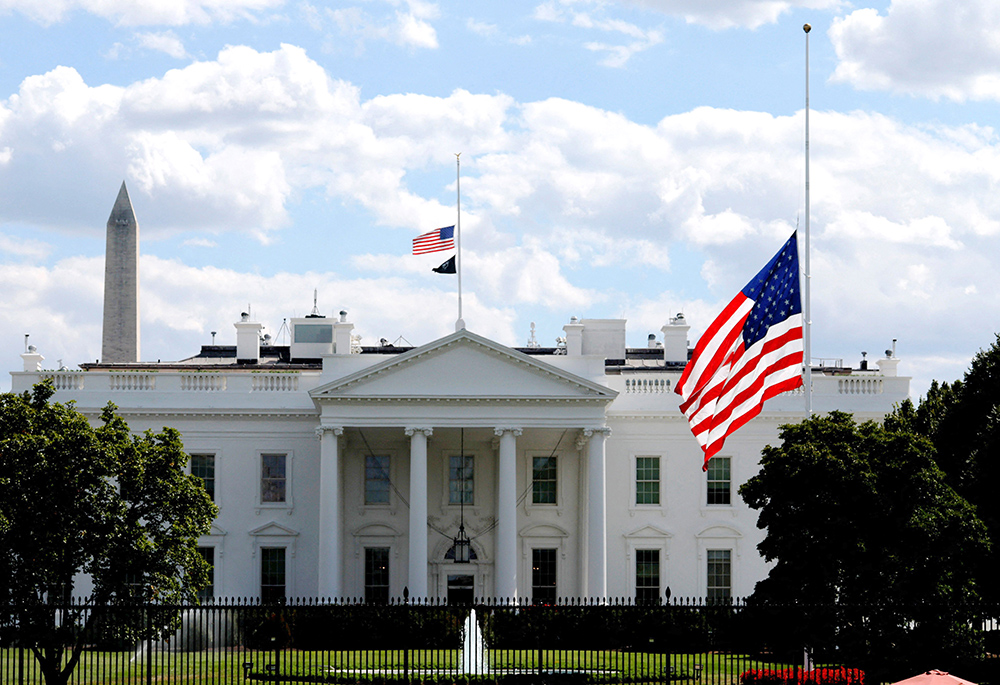 Flags at the White House in Washington fly at half staff following a deadly shooting incident in the church at Annunciation Catholic School in Minneapolis. A shooter opened fire with a rifle through the windows of the school's church and struck children celebrating Mass Aug. 27 during the first week of school, killing two and wounding 21 people in an act of violence the police chief called "absolutely incomprehensible." (OSV News/Reuters/Brian Snyder)