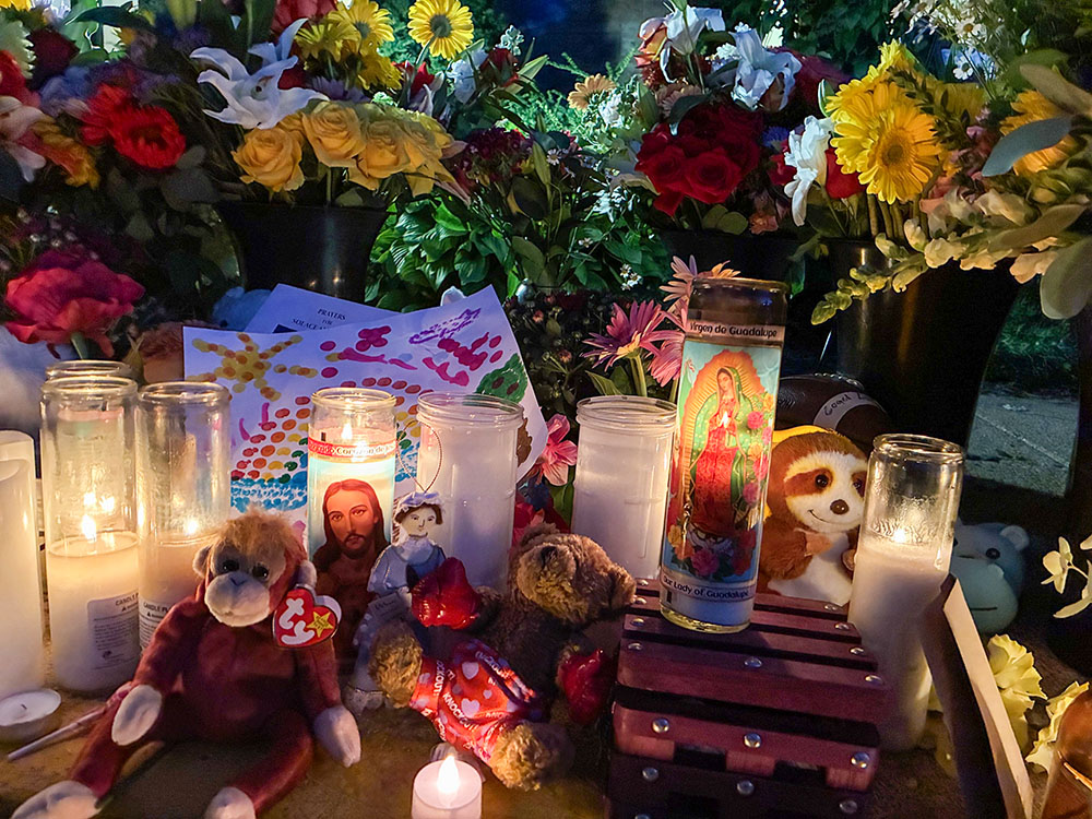 Candles, flowers and stuffed animals are seen in a community memorial outside Annunciation Catholic Church in Minneapolis Aug. 28, 2025. (OSV News/Maria Wiering)