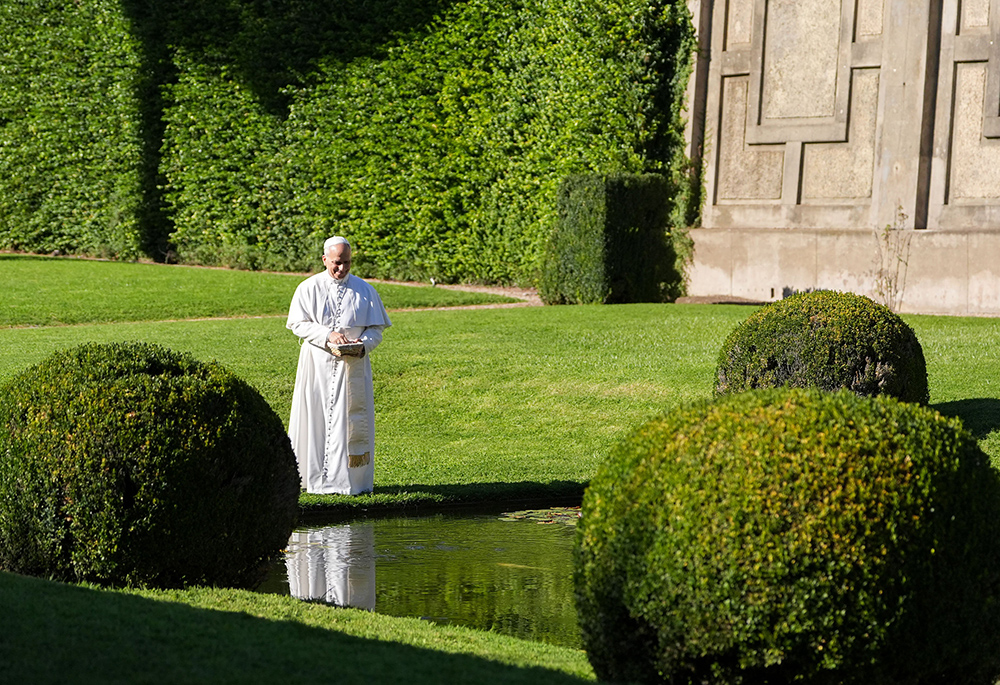 Pope Leo XIV feeds fish at a pond in the Pontifical Gardens of Castel Gandolfo, Italy, Sept. 5, 2025. The pope inaugurated Borgo Laudato Si’ the same day, opening the historic papal residence as a center dedicated to the principles of care for creation and human dignity outlined in Pope Francis’ encyclical Laudato Si’. (CNS/Lola Gomez)