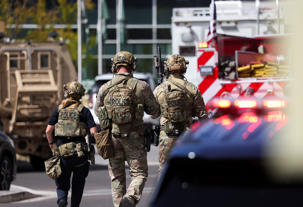 Law enforcement officers work at the crime scene at Utah Valley University where U.S. right-wing activist Charlie Kirk was shot and killed during an event in Orem Sept. 10, 2025. (OSV News/Reuters/Jim Urquhart)