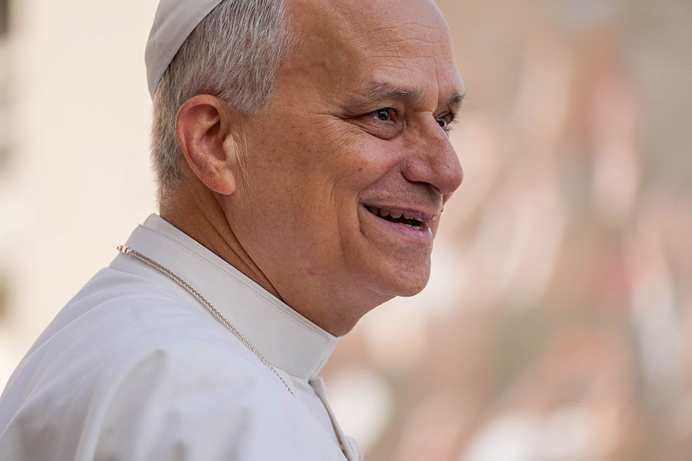 Pope Leo XIV smiles as he greets visitors and pilgrims from the popemobile as he rides around St. Peter's Square at the Vatican before his weekly general audience Sept. 17, 2025. (CNS/Lola Gomez)