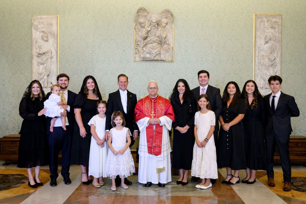 Pope Leo XIV poses for a photo with Brian Burch, the new U.S. ambassador to the Holy See, the ambassador's wife, Sara, and their nine children, daughter-in-law and granddaughter in the Apostolic Palace at the Vatican Sept. 13. (CNS/Vatican Media)