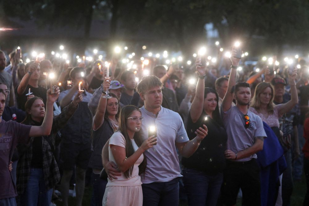 Young people use their cellphone lights during a vigil at Orem City Center Park in Utah Sept. 11  after U.S. conservative activist and commentator Charlie Kirk, 31, was fatally shot during a Sept. 10 event at Utah Valley University in Orem. (OSV News/Reuters/Jim Urquhart)