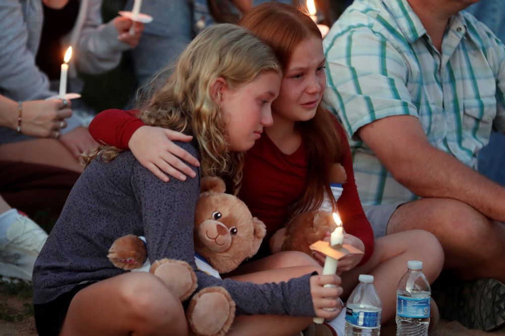 People gather at a vigil at Lynnhurst Park after a fatal shooting at the Annunciation Catholic School, Aug. 27 in Minneapolis. (AP Photo/Bruce Kluckhohn)