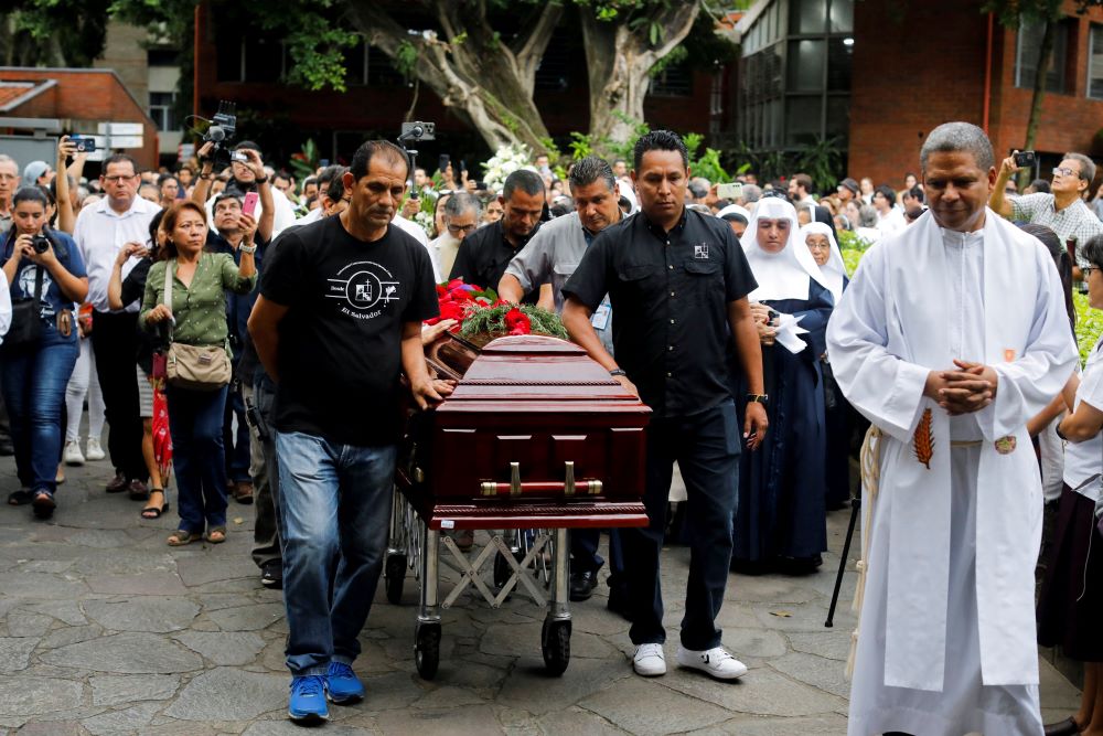 Pallbearers walk with the casket of Jesuit Fr. José María Tojeira during his funeral procession at the Central American University in Antiguo Cuscatlan, El Salvador.