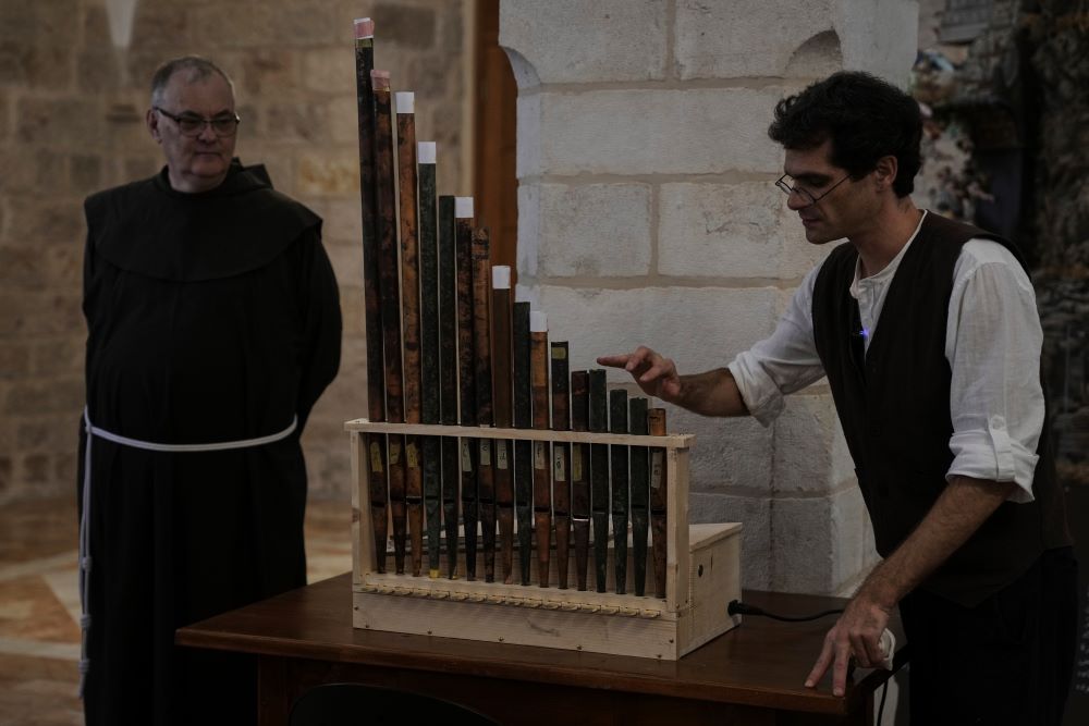 David Catalunya displays an 11th-century organ. 