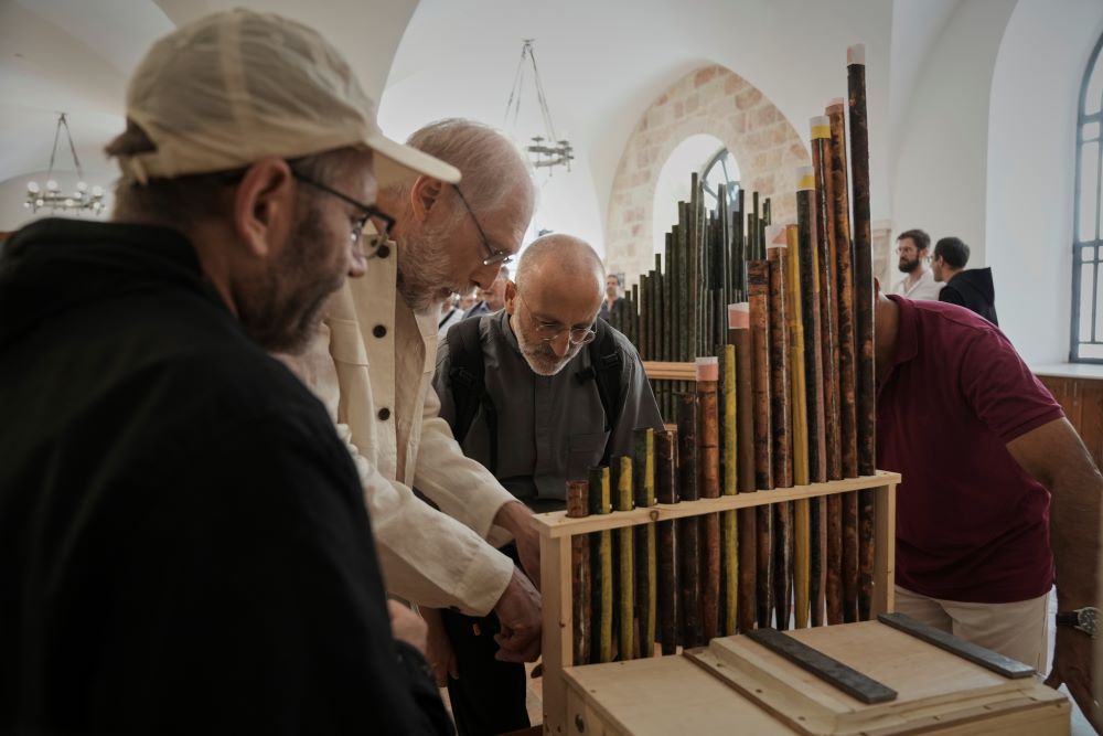 People look at an 11th-century organ.