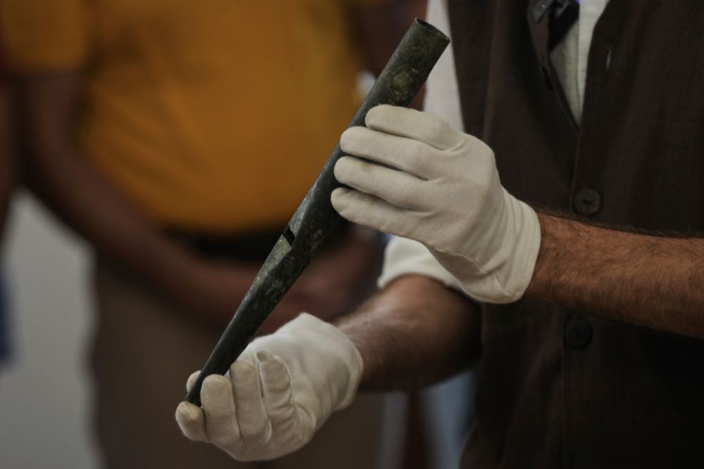 David Catalunya, a Valencian musician and musicologist displays a piece of an 11th-century organ.