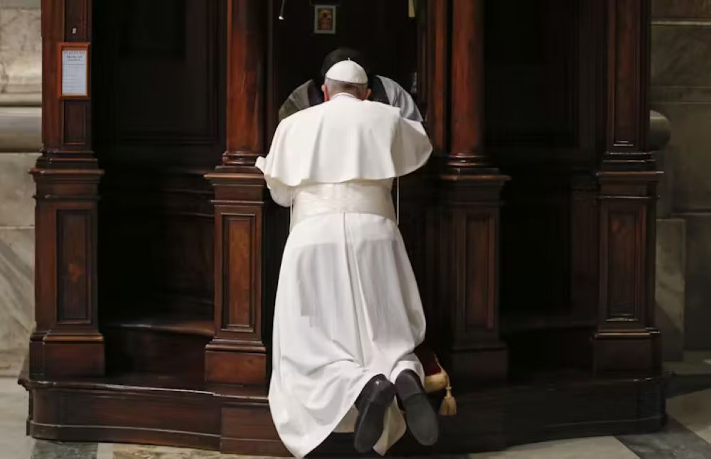 Pope Francis kneels in confession during a penitential liturgy in St. Peter’s Basilica at the Vatican, March 9, 2018. (The Conversation/Stefano Rellandini/Pool photo via AP)