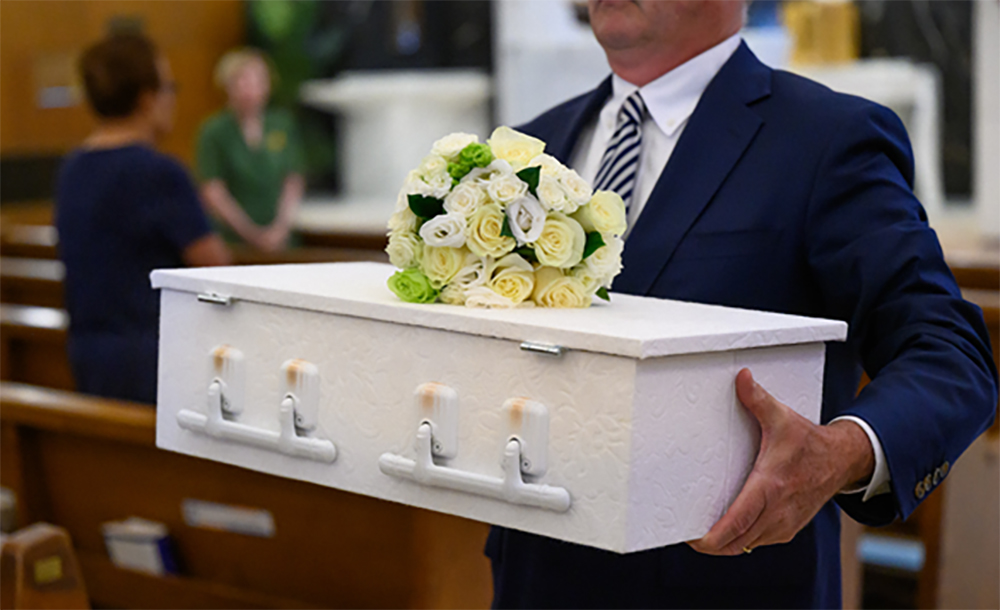 An infant's funeral takes place at St. Anthony Shrine in Boston. (Julianne Gauron)