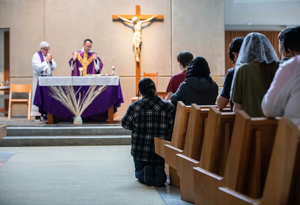 People kneel during Mass. (Unsplash/Diocese of Spokane)
