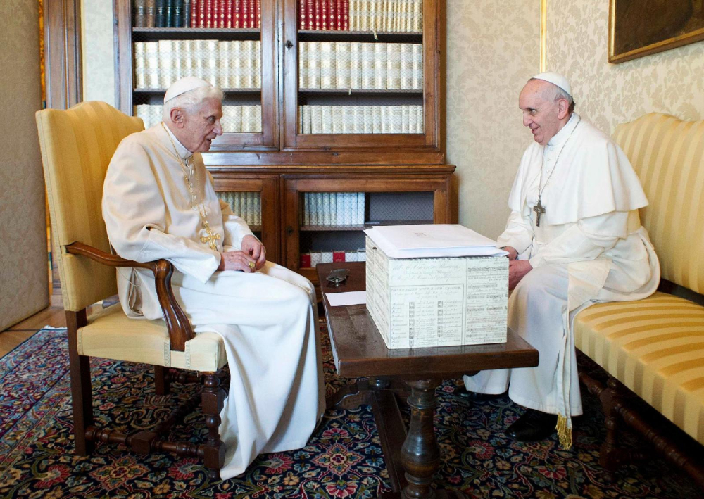 Pope Francis talks with retired Pope Benedict XVI at the papal summer residence at Castel Gandolfo, Italy, March 23, 2013. (OSV News/Reuters/Vatican Media)