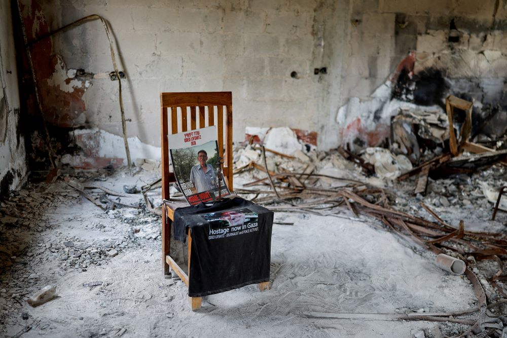 A poster with a picture of Oded Lifshitz, 84, who was kidnapped during the deadly Oct. 7, 2023, attack by Hamas, is placed on a chair on the day of a commemorative memorial in Kibbutz Nir Oz, southern Israel, Oct. 6, 2025. Lifshitz was later killed in captivity. (OSV News/Reuters/Amir Cohen)