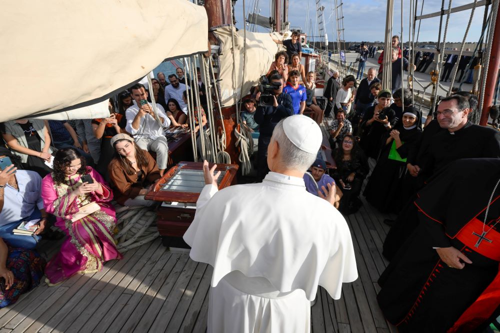 Pope Leo XIV speaks to young adults aboard the "Bel Espoir" ("Beautiful Hope") sailboat. 