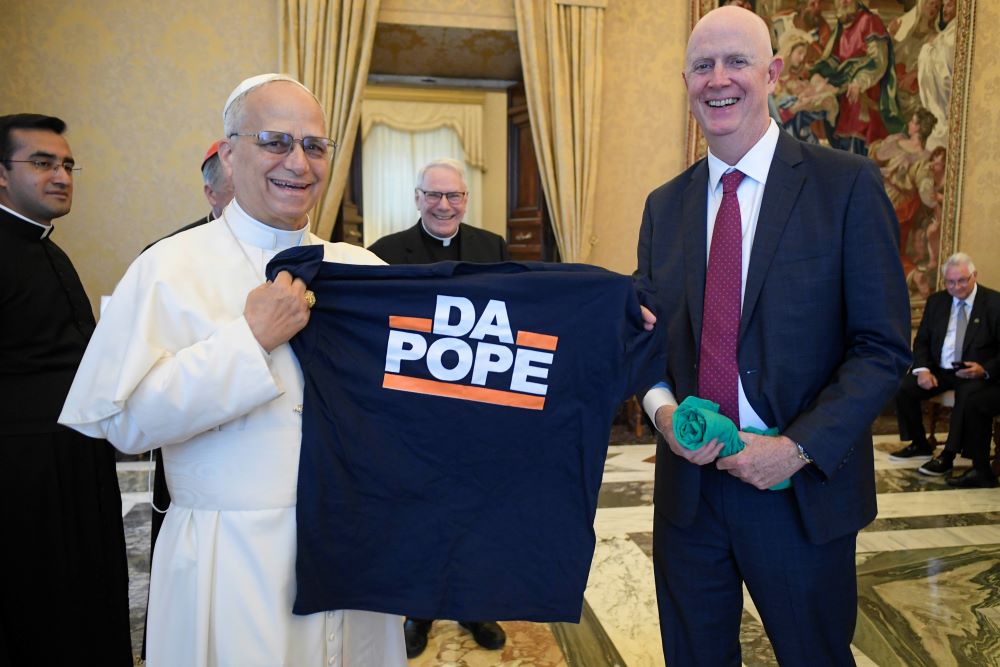 Pope Leo XIV receives a T-shirt that says, "Da Pope," from a member of a pilgrimage of labor union leaders from Chicago visiting the Vatican Oct. 9. (CNS/Vatican Media)