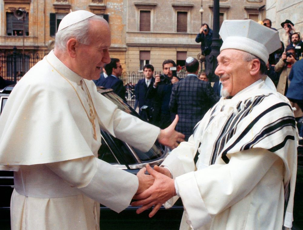 Pope John Paul II greets Rabbi Elio Toaff in 1986 at Rome's main synagogue.