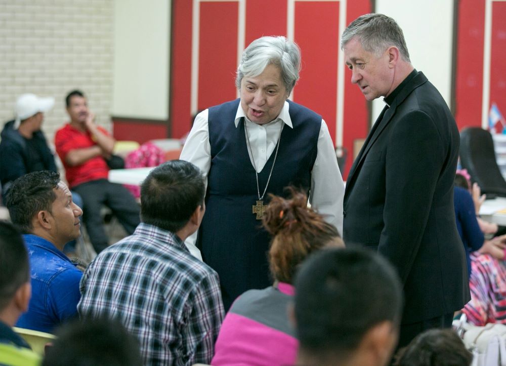 Sr. Norma Pimentel and Cardinal Blase Cupich of Chicago greet asylum-seekers in 2017 at the Humanitarian Respite Center in McAllen, Texas. 