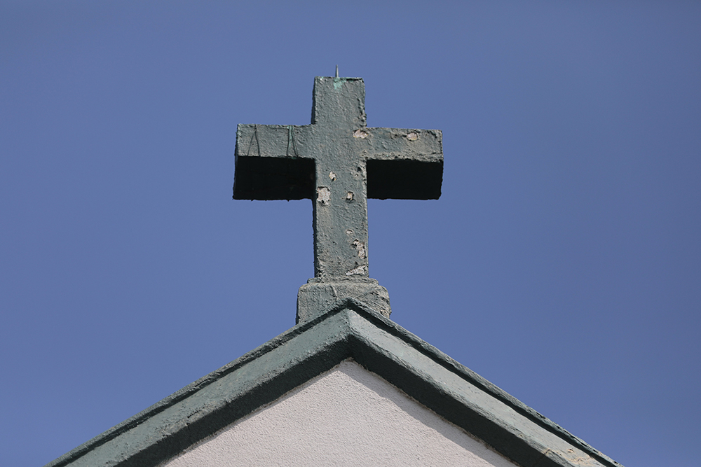 A cross is pictured atop Our Lady Star of the Sea Church in Solomons, Md., Aug. 26, 2021. (OSV News/Bob Roller)