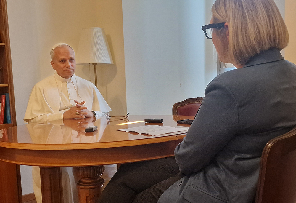 Pope Leo XIV sits with Elise Allen, senior correspondent at Crux, for an interview at the pope's residence inside the Vatican's Palazzo Sant'Uffizio July 30, 2025. (CNS/Courtesy of Crux)