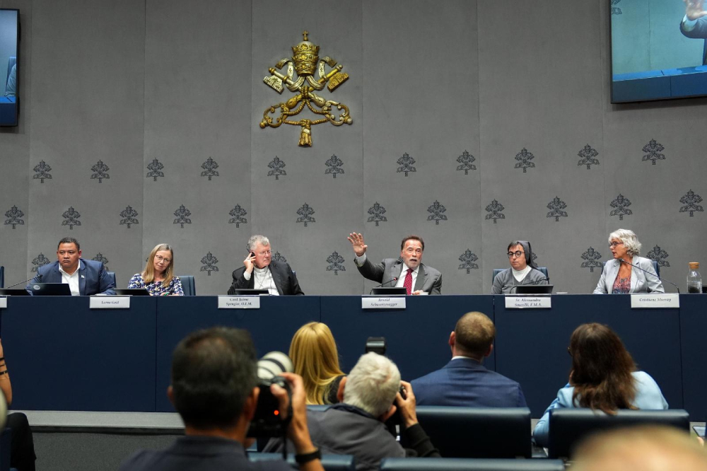 Arnold Schwarzenegger, actor and former California governor, gestures during a Vatican news conference on “Raising Hope for Climate Justice” Sept. 30, 2025. He is joined on the panel by Brazilian Cardinal Jaime Spengler of Porto Alegre, Salesian Sister Alessandra Smerilli, secretary of the Dicastery for Promoting Integral Human Development, and others. (CNS/Lola Gomez)