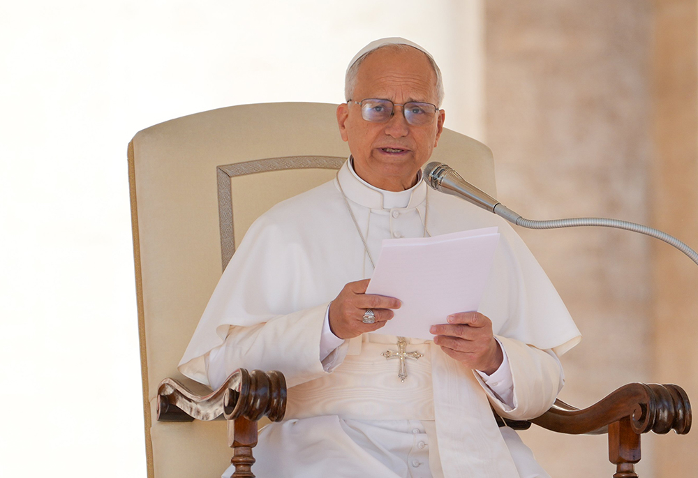 Pope Leo XIV talks to visitors during his weekly general audience in St. Peter's Square at the Vatican Oct. 8. (CNS/Lola Gomez)