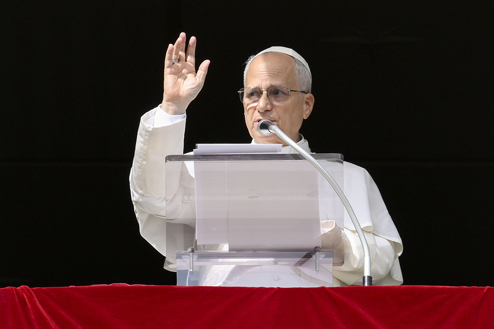 Pope Leo XIV gives his blessing to the crowd gathered in St. Peter's Square at the Vatican to pray the Angelus with him Oct. 26, 2025. (CNS/Vatican Media)