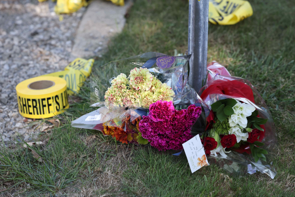 Flowers are left at a police blockade near the Church of Jesus Christ of Latter-day Saints, Monday, Sept. 29, 2025 in Grand Blanc Township, Mich. (AP/Carlos Osorio)