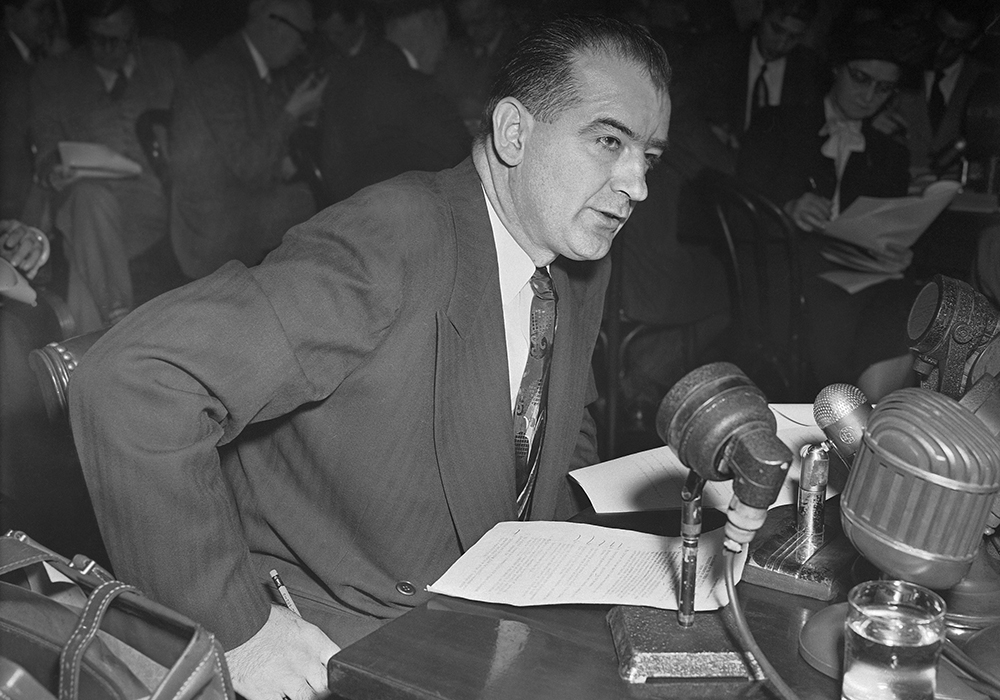In this file photo, Sen. Joseph McCarthy, R-Wis., accuses Haldore Hanson, key State Department official, of "pro-Communist" activities dating back to 1938, during a Senate foreign relations subcommittee, March 13, 1950. Author Clay Risen explores Congress's investigation of Communism in the federal government and Hollywood in the 1950s in his book Red Scare. (AP photo/Herbert K. White, file)