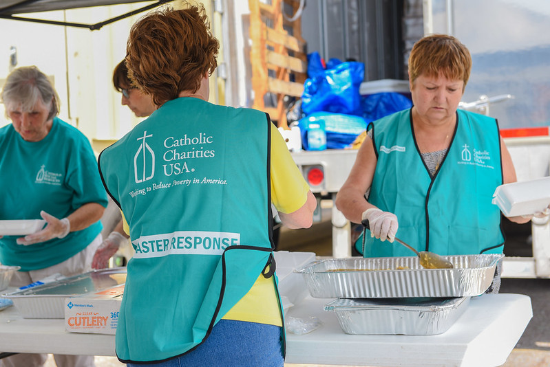 Catholic Charities staff and volunteers serve meals in Louisiana in the aftermath of Hurricane Ida in 2021. (Courtesy of Catholic Charities USA/Elias Kontogiannis)