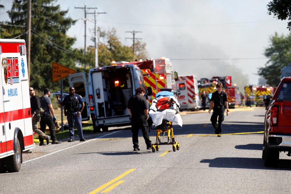 Smoke rises as members of emergency personnel work at the scene of a shooting at the Church of Jesus Christ of Latter-day Saints, according to police, in Grand Blanc, Mich., Sept. 28, 2025. A gunman opened fire inside the church during a Sunday service and set the building ablaze, killing at least four people and injuring at least eight others. Police shot and killed the suspect, authorities said. (OSV News/Reuters/Rebecca Cook)