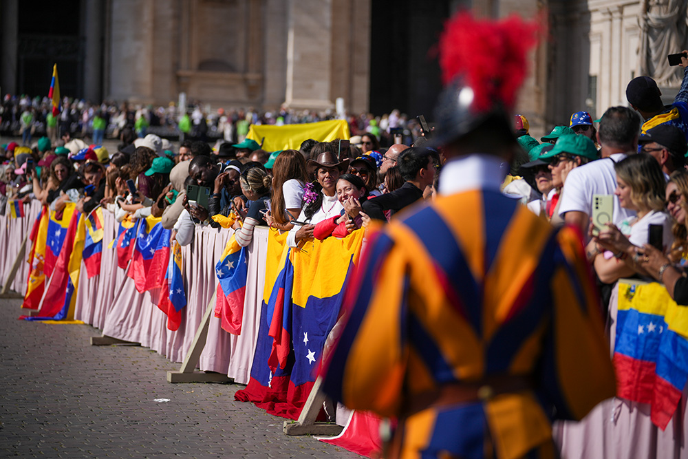 Faithful and pilgrims from Venezuela listen to Pope Leo XIV presiding over a Mass in St. Peter's Square at the Vatican, during which he canonized seven new saints of the Catholic Church, Oct. 19, 2025. (AP/Andrew Medichini)