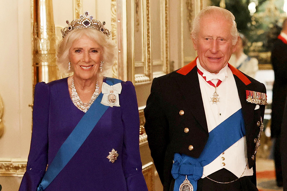 Britain's Queen Camilla, left, and King Charles III, right, pose for a photo before a State Banquet at Windsor Castle, in Windsor, England, Sept. 17, 2025. (Phil Noble/Pool Photo via AP, file)