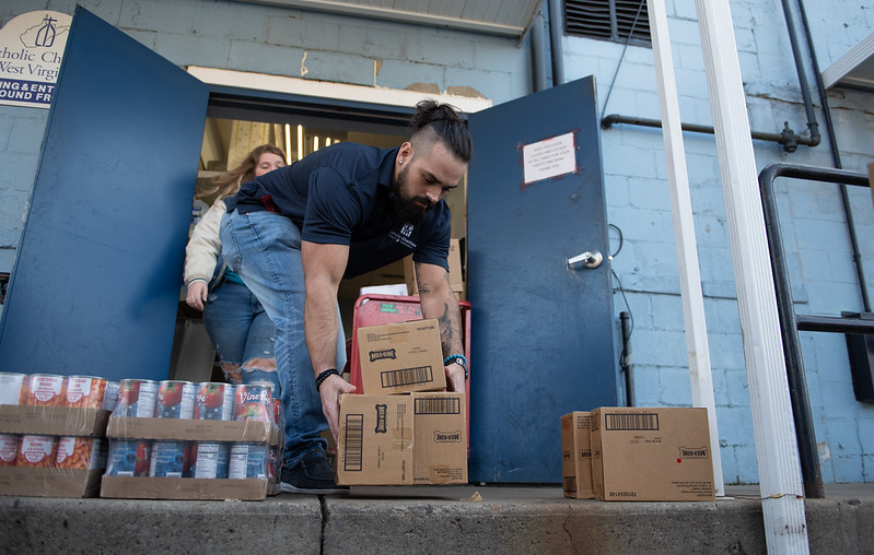  Catholic Charities West Virginia staff gather supplies for a food pantry. (Courtesy of Catholic Charities USA/Elias Kontogiannis)