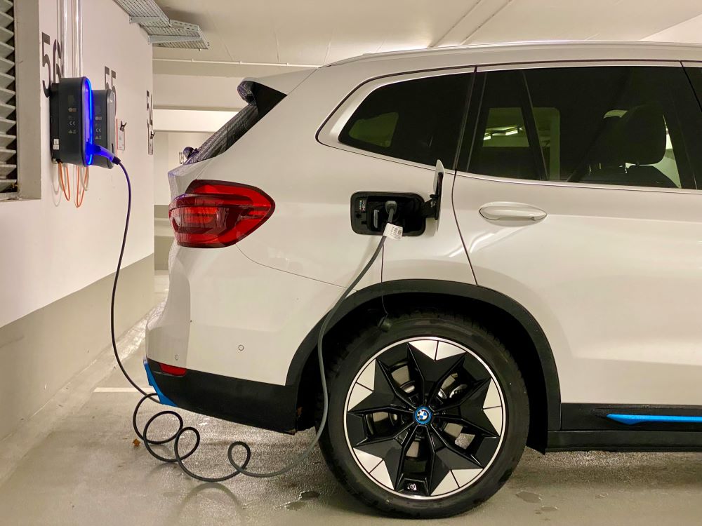 electric vehicle plugged into charging station