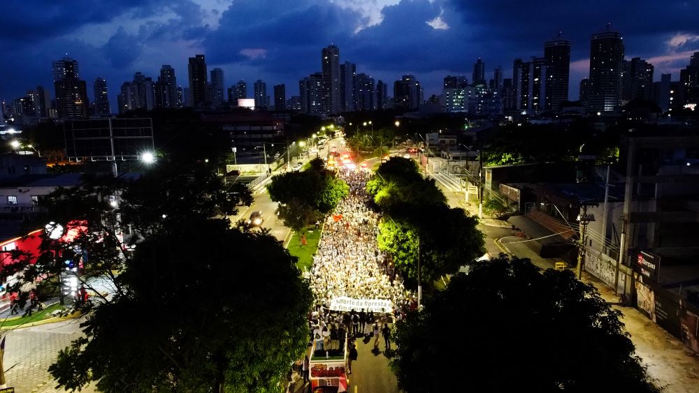 Activists fill the street in this drone image during the "Porongaço" march of the Forest Peoples during COP30 in Belém, Brazil. The name "Porongaço" comes from the poronga, the oil lamp used by rubber tappers during their night work in the forest. 
