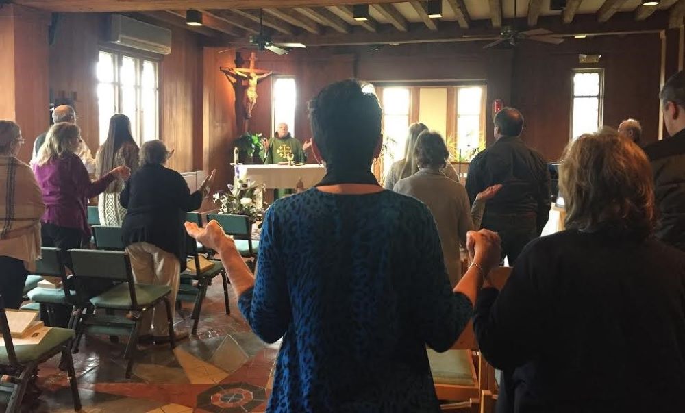 Mass is celebrated at Emmaus Ministry retreat.