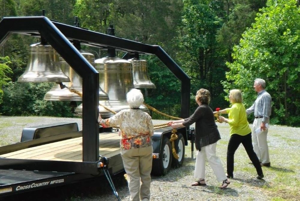 Memorial bells are rung in honor of deceased children at an Emmaus Ministry for Grieving Parents retreat.