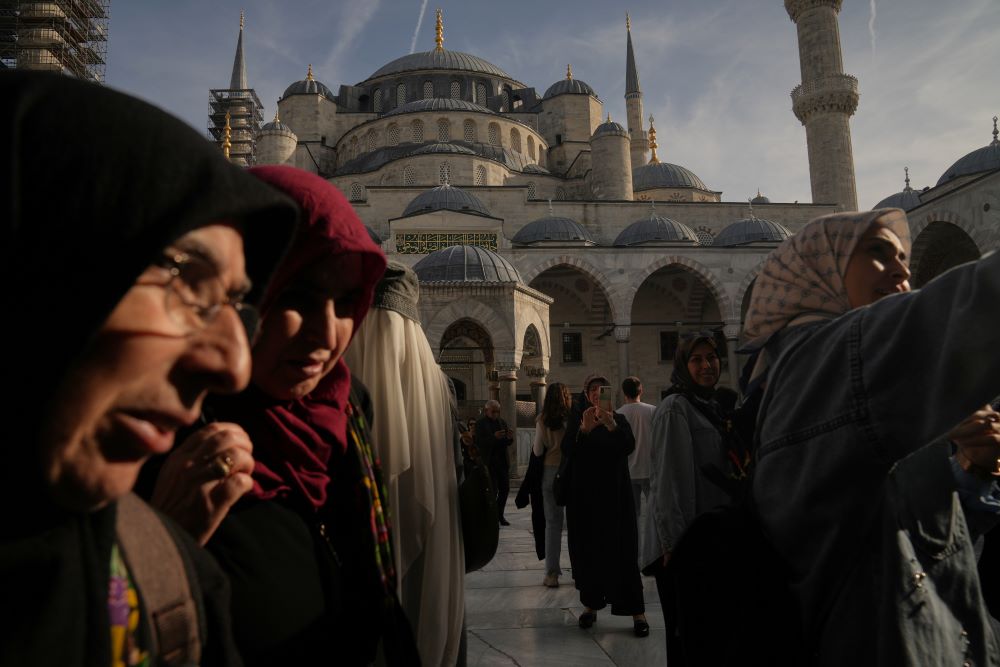 Locals and tourists visit the Ottoman-era Sultan Ahmed or Blue Mosque, in Istanbul, Turkey, Nov. 21, 2025, ahead of the visit of Pope Leo XIV to Turkey. 