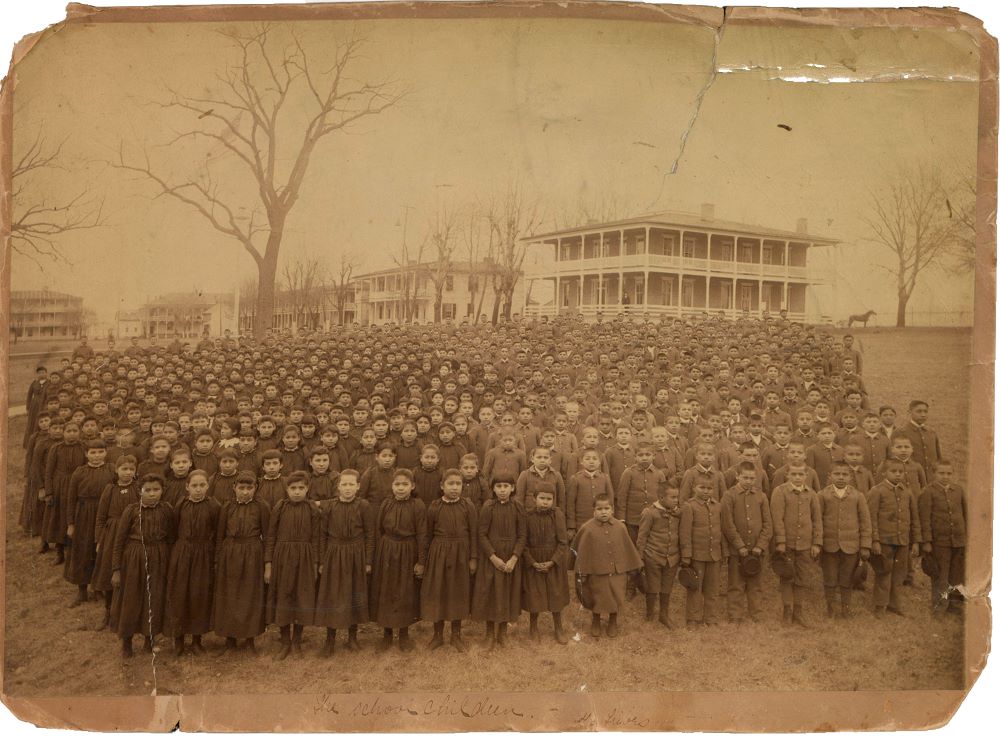 The 1892 student body of the Carlisle Indian Industrial School assembles on the school grounds in Carlisle, Pa.