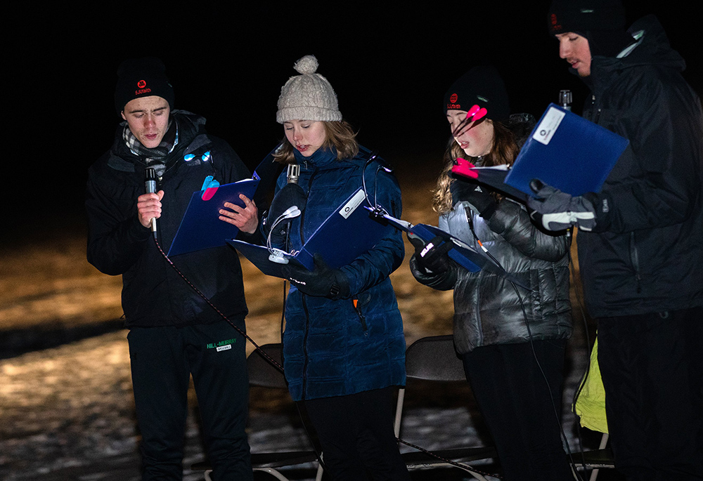 Students from the College of St. Benedict in St. Joseph, Minnesota, and St. John's University in Collegeville, Minnesota, attend Mass Feb. 20, 2022, on the frozen ice of Lake Sagatagan on St. John's campus. (CNS/Courtesy College of St. Benedict and St. John's University)