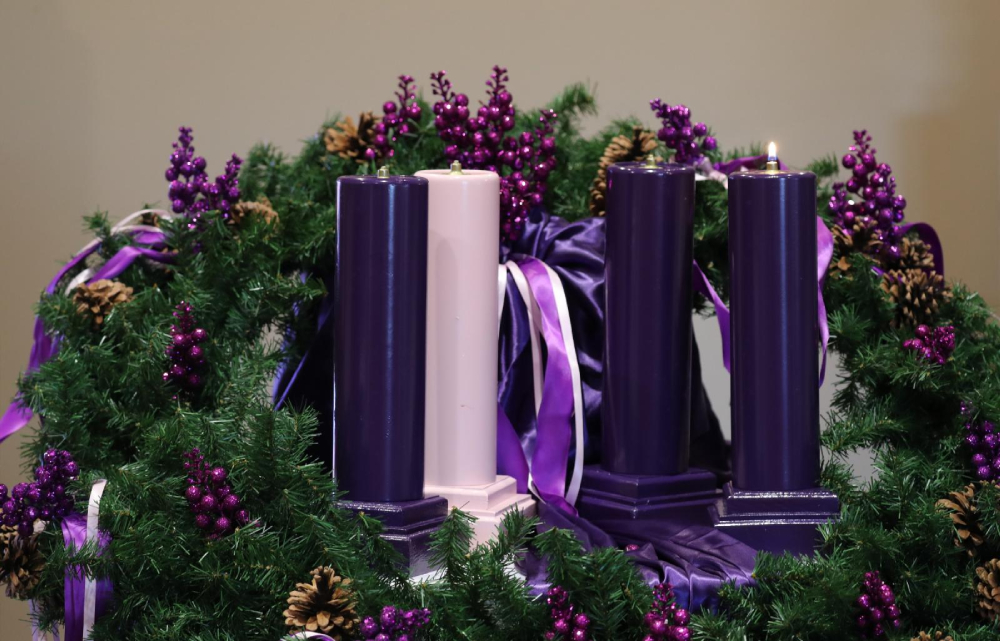 One purple candle is lit on an Advent wreath, the central symbolic rite of spiritual preparation for Christmas. Purple is the color of penitence and humility. The rose colored candle, lit the Third Week of Advent, represents a hopeful look toward Christ's coming. (OSV News/Bob Roller)