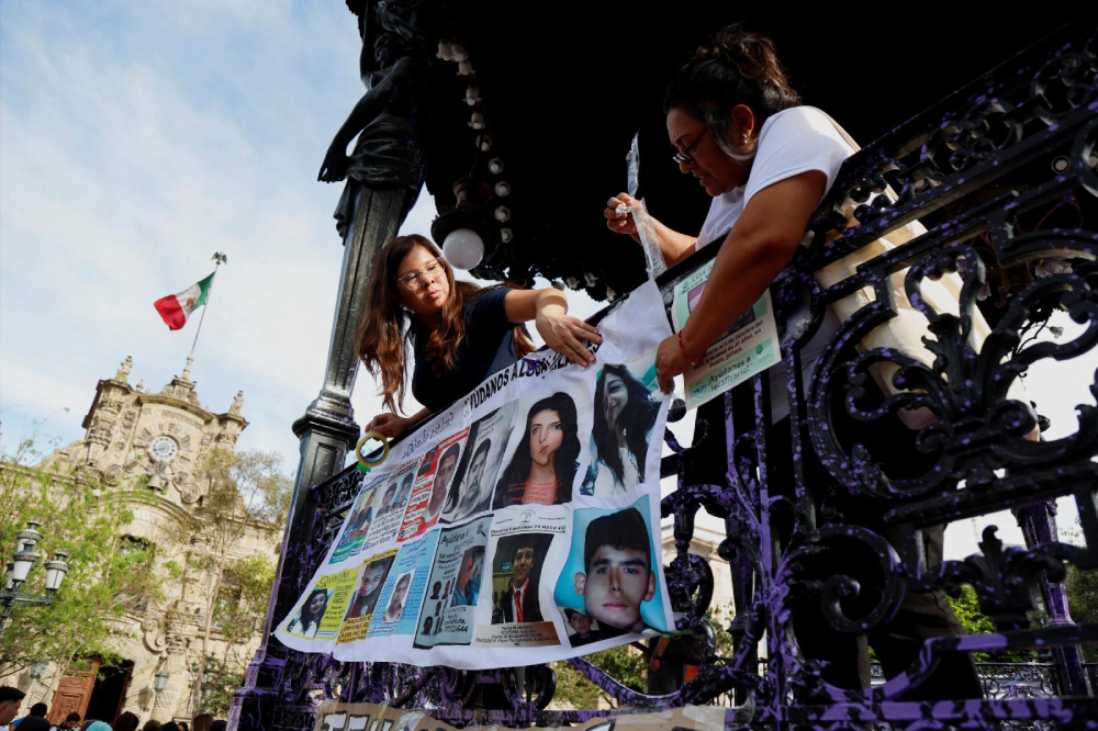 People take part in a vigil in Guadalajara, Mexico, March 15, 2025, for the victims of a clandestine mass grave found in Teuchitlan, in the state of Jalisco. Mexico's Catholic leaders prayed for the country's missing and urged the population of the country and their political leaders to listen to victims of violence amid outrage over the discovery of mass graves and ovens for cremating bodies on a drug cartel compound. (OSV News/Reuters/Michelle Freyria)