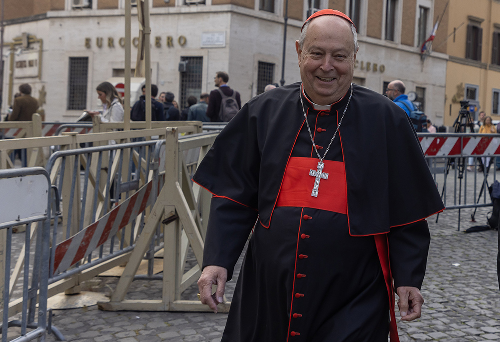 Cardinal Oscar Cantoni of Como, Italy, approaches the Petriano entrance to the Vatican next to St. Peter's Square to attend the fifth general congregation meeting of cardinals April 28, 2025. (CNS/Pablo Esparza)