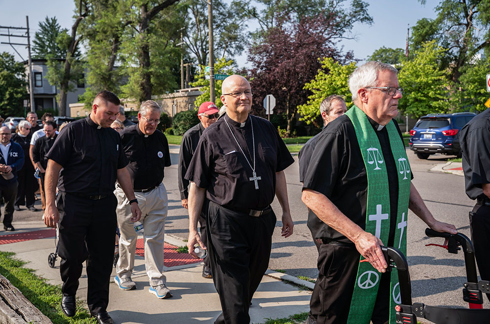Detroit Archbishop Edward Weisenburger joins other clergy during a procession from Most Holy Trinity Church in Detroit's Corktown neighborhood to the ICE Regional Field Office on Michigan Avenue in downtown Detroit July 14, 2025. The procession was organized by Strangers No Longer, a Catholic grassroots immigrant rights advocacy group. (OSV News/Detroit Catholic/Valaurian Waller)