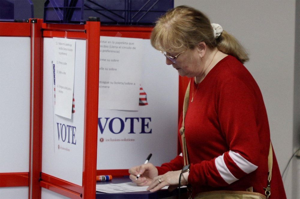 A woman fills out her ballot at an early voting station in Green Bay, Wis., March 19, 2025. (OSV News/Reuters/Eric Cox)