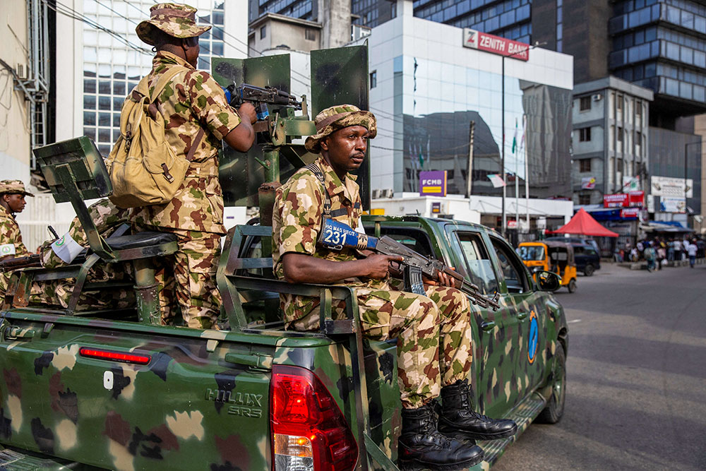 Nigerian soldiers patrol near a market to prevent violence in Lagos Island Feb. 27, 2023. (OSV News/Reuters/James Oatway)