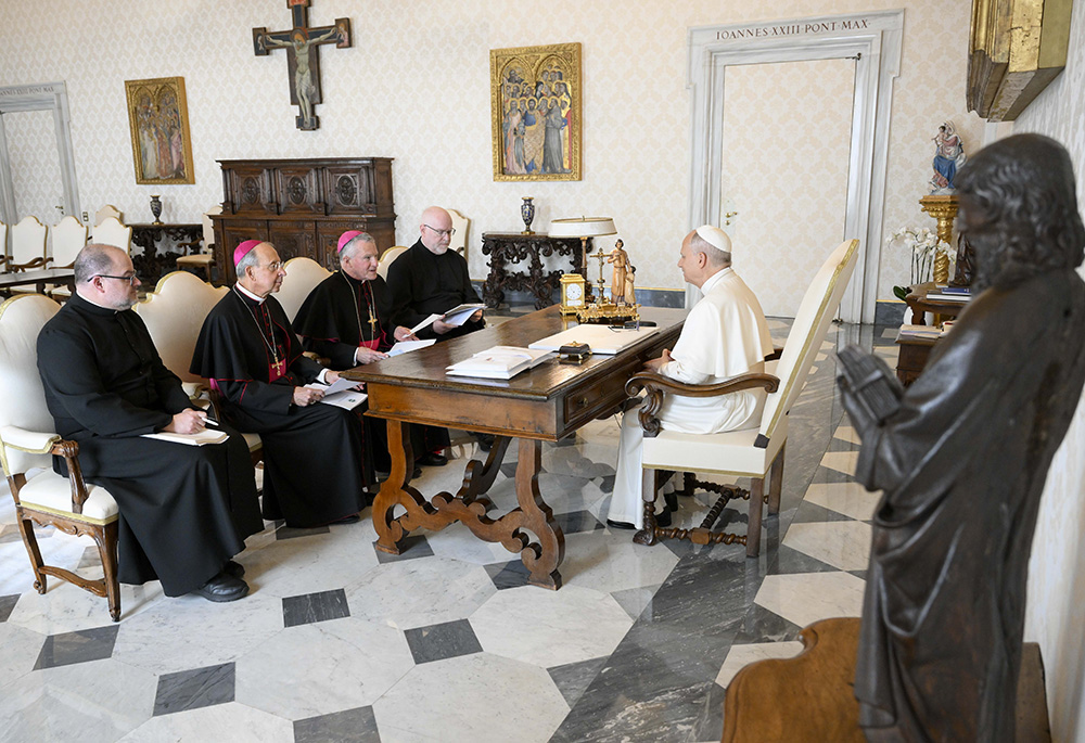 Pope Leo XIV meets with officials of the U.S. Conference of Catholic Bishops, in the library of the Apostolic Palace at the Vatican Oct. 10, 2025. From the left are: Fr. Michael Fuller, general secretary; Baltimore Archbishop William E. Lori, vice president; Archbishop Timothy P. Broglio, president; and Fr. Paul Hartmann, associate general secretary. (CNS/Vatican Media)
