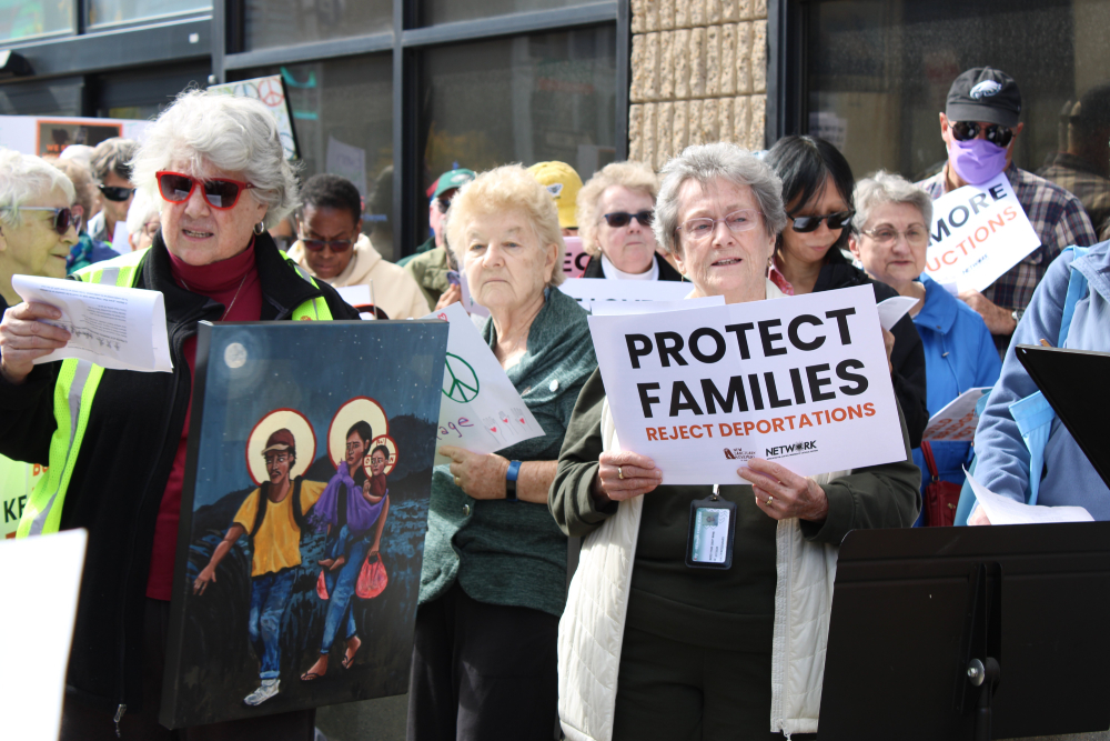 Participants gathered Oct. 22, 2025, in front of the U.S. Immigration and Customs Enforcement offices in Philadelphia as part of the nation-wide "One Church, One Family" prayer vigils organized by the Jesuits West province and several Catholic organizations, including the U.S. Conference of Catholic Bishops' Migration and Refugee Services, to protest mass deportations and promote pastoral accompaniment for immigrants lacking permanent legal status in the U.S. (OSV News/Gina Christian)